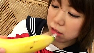 Asian teen with a banana