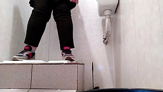 Hot milf pissing in public toilet