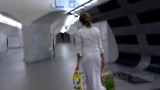 Upskirt without panties. Blonde in long white skirt.