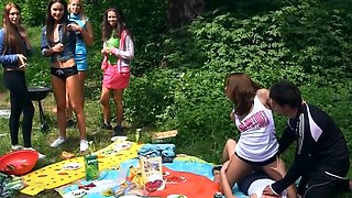 Naughty babes merge bodies and start touching pussies at picnic