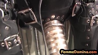 Latex BDSM femdom drains sissy dick with milking machin