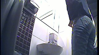 Redhead stranger white girl in the public restroom filmed from behind