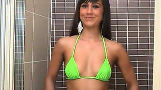 Young Brunette Peacherino Lacey Takes off Her Green Bikini and Covers Her Tits with Lotion Soap