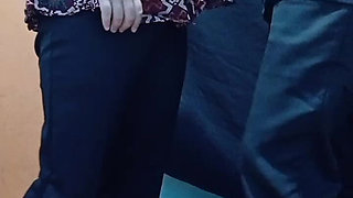 A Lonely Woman Wearing a Hijab in a Boarding