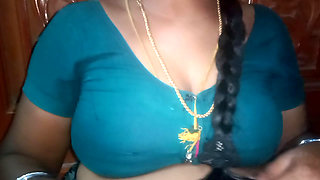 Tamil aunty squeezing her breasts when she is alone and unable to control her emotions.