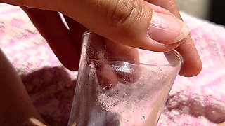 Inserting a Small Cup Into the Wet Pussy