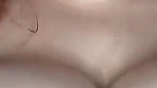 She gets horny by kneading her huge tits with oil until she stains her thong