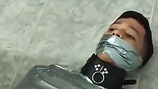 Latino Hunk Heavily Mummified by Cooperative Femdom Women