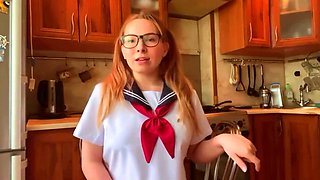 Girl in Japanese school uniform masturbates and reaches orgasm in the kitchen while cosplaying