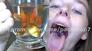 Evil white woman devours live fish in bathroom - vore giante