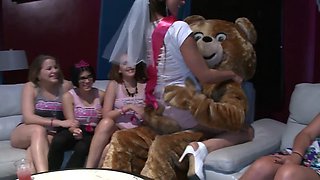 Muscular male stripper is called over to a bachelorette party