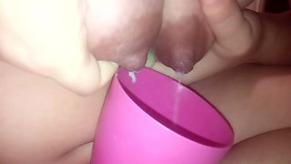 Young Mom Pours Milk From Boobs Into A Cup