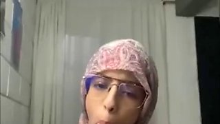 Arab wearing her hijab and having sex with several cocks in an anal way moans with pleasure
