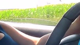 Topless Car Dricing in the Midde of Day