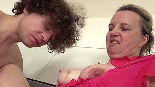Katka Nova gets her pussy jerked off by her mature lover in the kitchen