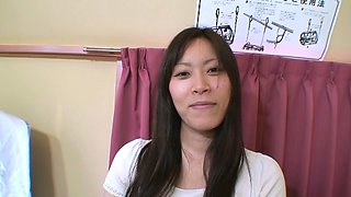 This sexy brunette Asian babe enjoys playing