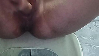 Masturbating