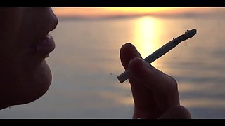 Smoking Cigarettes on the Beach... at Day and in Sunset.