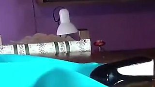 MILF with Beautiful Legs in Pantyhose and Heels Lying on the Table