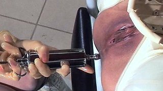Fetish lesbians toy their asses with plugs