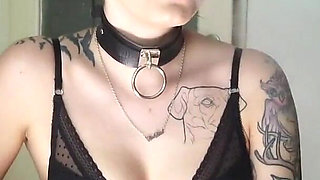 Tattooed gothic lady smoking in the kitchen