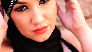 Very hot arab girl in a hijab smoking