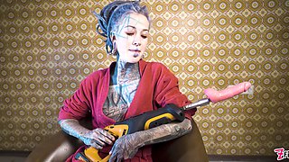 Tattooed Woman Testing Fuck Machine with Her Anal