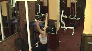 Sexy brunette stripping in the gym!