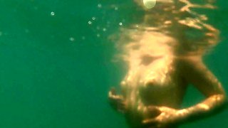 A sexy girl Lovita Fate playing on the beach in a bikini