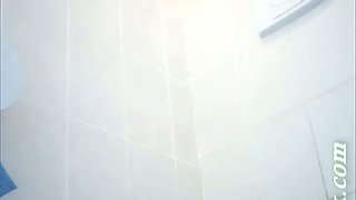 Long haired hot blonde girl pisses in the toilet room