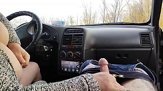 Jerking off a cock in the car