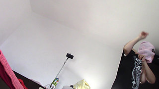 Amateur wife dancing naked at home. Amateur woman has fun trying on clothes and cutting them