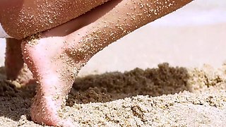 Petite Ukrainian MILF strips at a beach