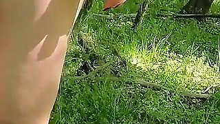 Beautiful Woman Undressing and Walking Nude with a Clit Pump Outdoors in a Public Forest