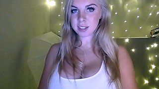 Blonde mature with big boobs masturbates in bed