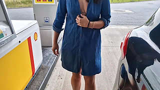 She Is Refueling at the Gas Station, Showing Her Tits and Pussy