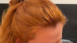 A redhead gives a blowjob to a guy she met during a walk in