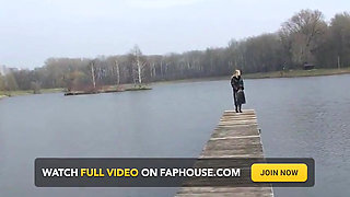Bitch in leather pissing on a pier