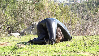 Flexible in a Black Catsuit