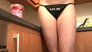 Blonde babe with big tits gets naked in the kitchen