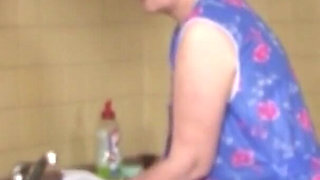 Old blonde German granny goes wild inside her pussy with a big young cock in the kitchen by fucking on the table