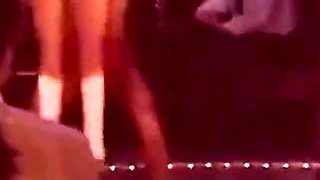 Blonde Stripper Bends Showing Shaved Pussy