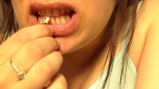 Giantess Girl Unwraps a Candy but Is Surprised Because There Is a Tiny Man in the Candy Bag - She Is Curious to See What It
