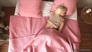 Impressive blonde babe is touching her shaved pussy with passion