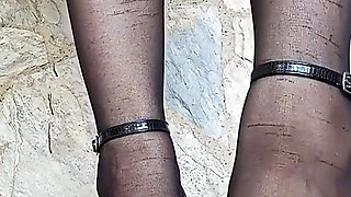 In Front of You the Secretary with Pantyhose and Stiletto Heels Dangling From Her Feet