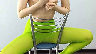 Redhead Teen Feeling Horny in Green Tights on Chair