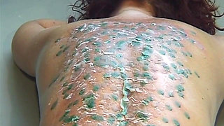 Mature MILF Enjoys Hot Wax Dripping Across Her Ass