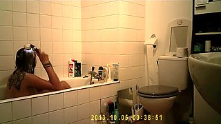 Brunette uses the toilet and takes a shower