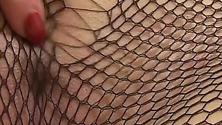 British MILF Penny Brooks Looks Delicious in Her Fishnet Tights