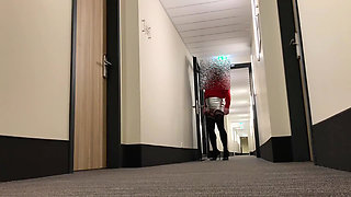 Crossdresser exposing in hotel hallway
